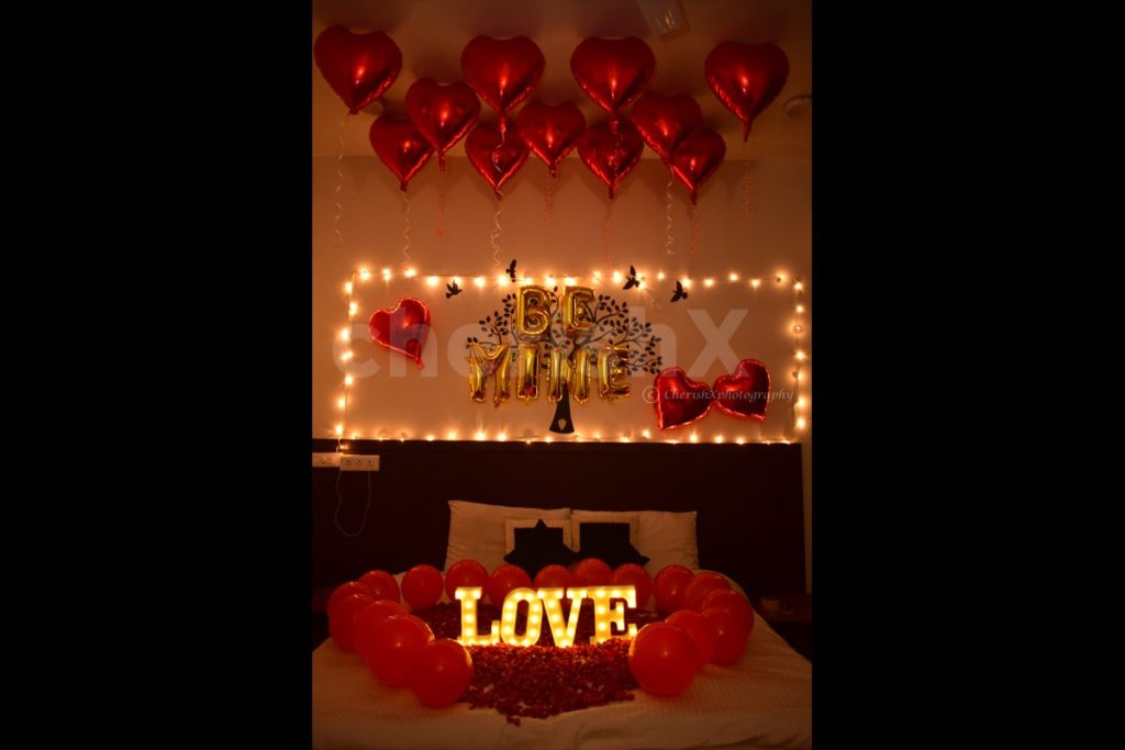 Beautiful Balloon theme Proposal idea in room featuring red balloons and heart shaped foil balloons 