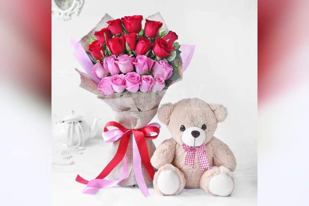 A cute teddy with a bouquet consisting red and pink roses and this make as one of the perfect teddy day gifts 