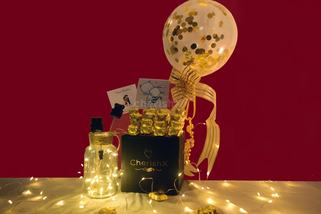 Hug Day Special gift featuring a confetti balloon bucket with chocolates 