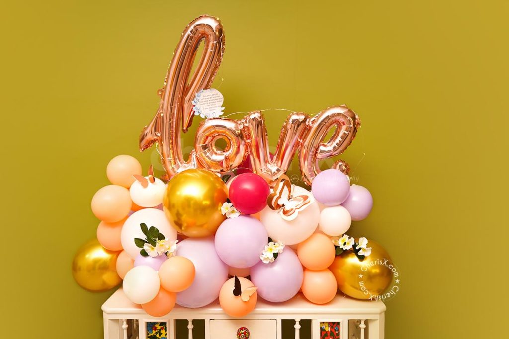 love balloon bouquet featuring pastel balloons and LOVE letter foil balloons for Valentine's day 