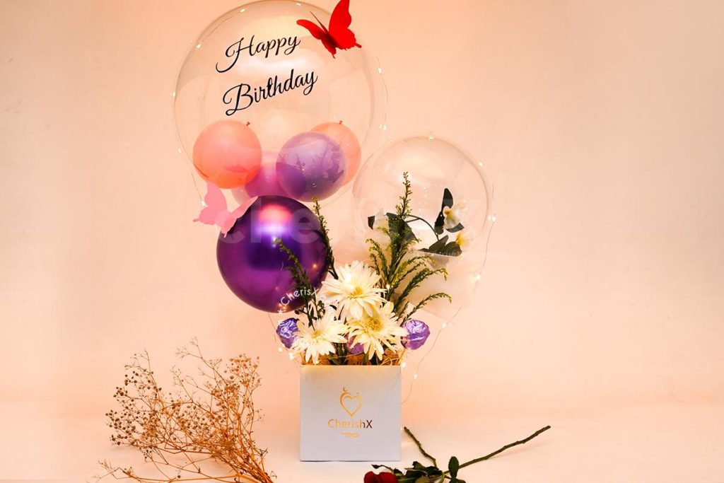 Luxury Pastel Balloon Bouquet with fresh flowers featuring one of the perfect rose day gifts 