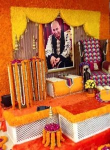 guruji darbar stage decor with marigold flowers