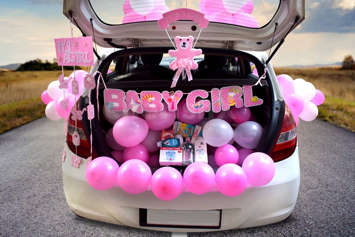 Baby Girl Creative Birthday Surprise in Car with pink and white balloons 