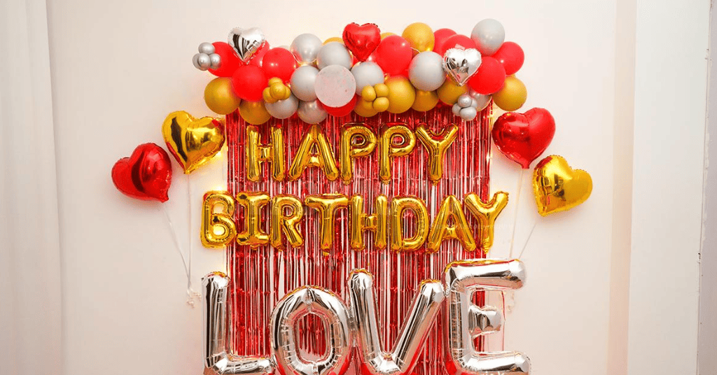 Red romantic party theme with balloons and sequins