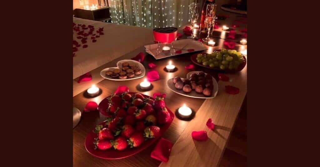 first night decoration ideas - Roses on bed with relishing food