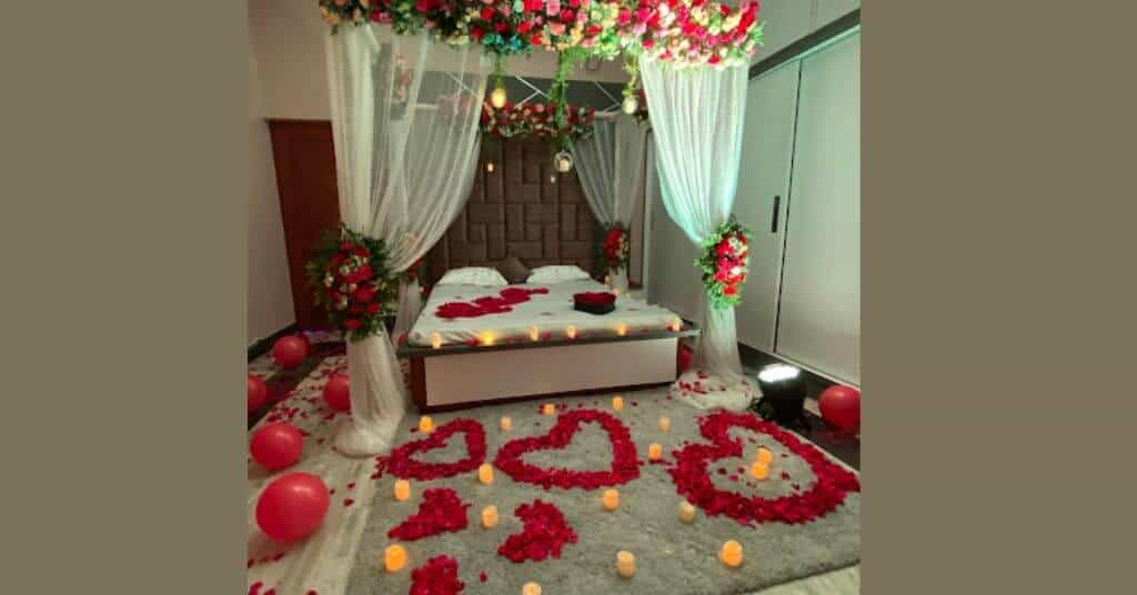 first night room decoration with roses, balloon, and drapes