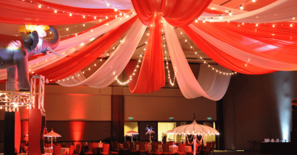white and red drapes for carnival theme party