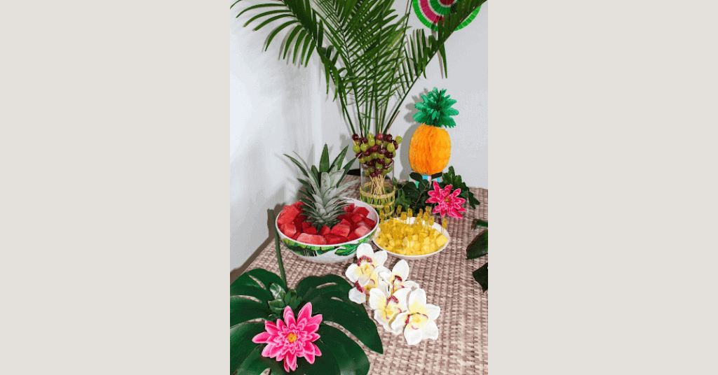 table setup with fruits and a touch of plant decoration.