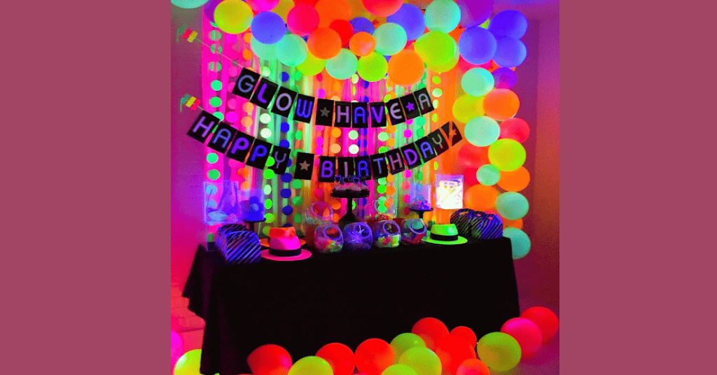 Neon party decoration with balloons and paper-cut-outs