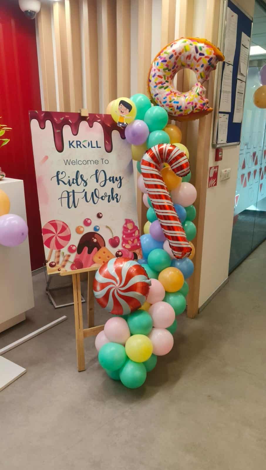 welcome banner in the office adorned with candyland theme decoration. 