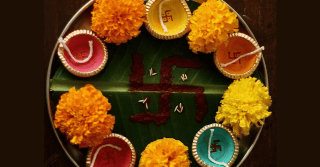 thali decoration ideas for navratri at home with marigold flowers and diyas