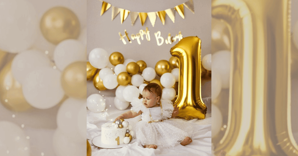 Golden chrome and white balloon for photo ideas for 1st birthday
celebration: Child sitting with a cake and '1' foil number.