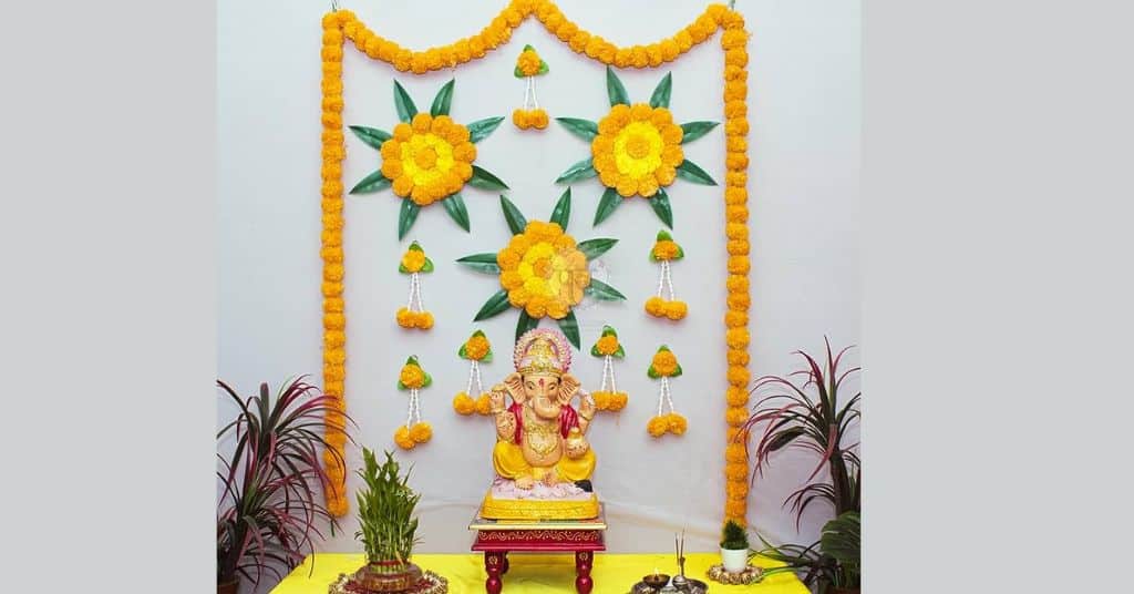 simple ganpati decorations at home with fresh marigold flowers 