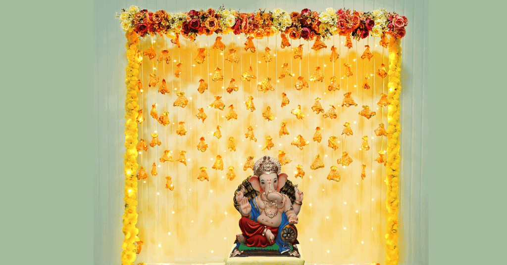 Yellow Tassels, artificial flowers and LED ligts backdrop for Ganesh Chaturthi decorations 