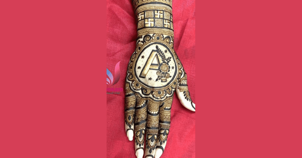 beautiful easy mehndi designs for karwa chauth with husband's initial on hand
