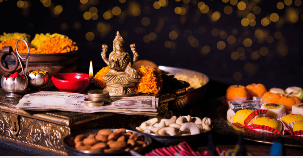 Goddess laxmi is offered flowers, sweets, and coins according to the Diwali pooja muhrat 