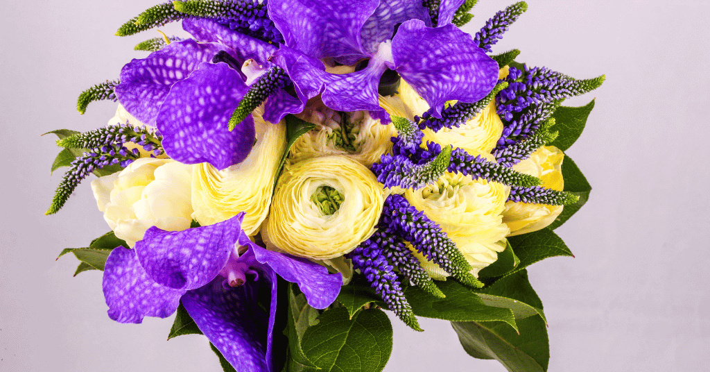 purple Iris flower bouquet with yellow flowers 