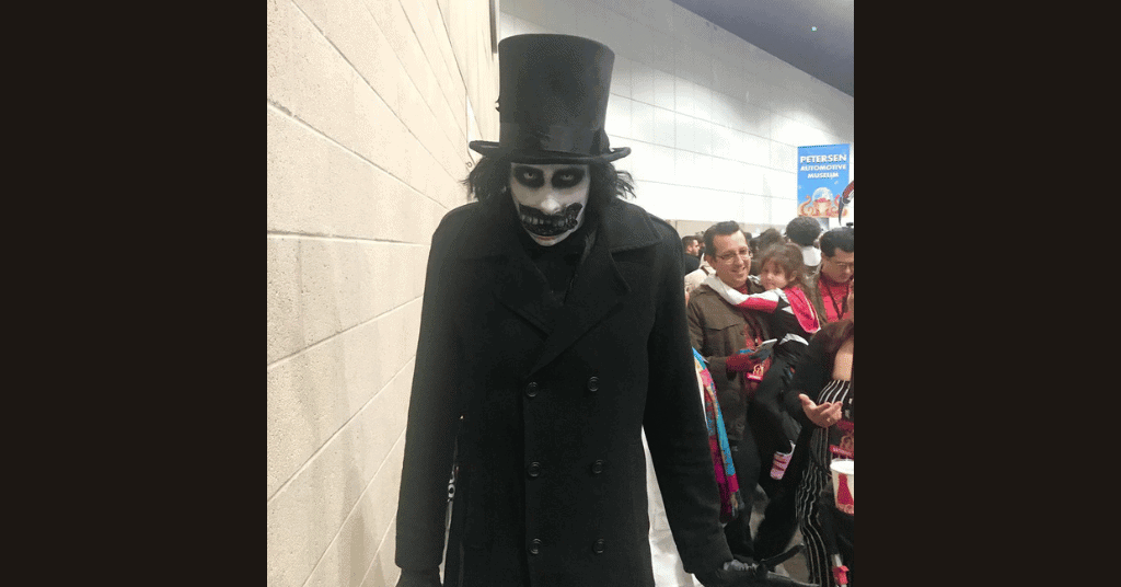 The Babadook inspired Halloween Outfit with white paint and crooked fake teeth