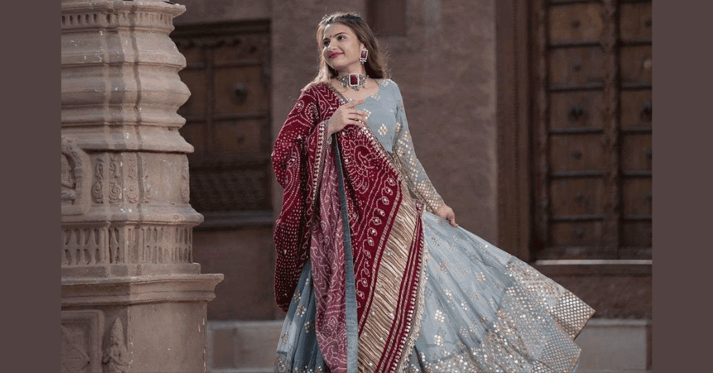 grey color Anarkali suit with red chunri 