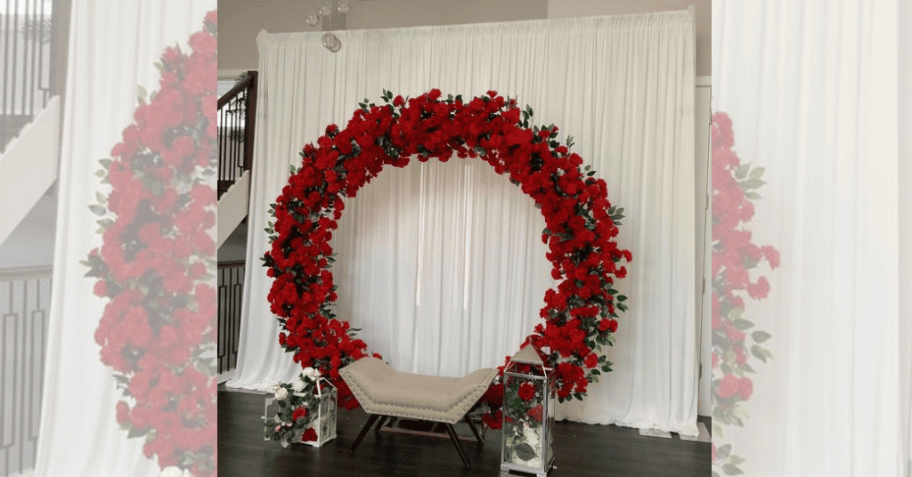 Low Budget Engagement Stage Decoration at Home With Ring Decor adorned with red flowers