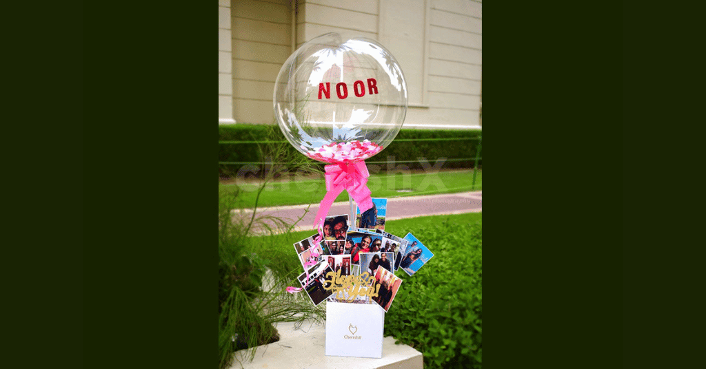 A wedding night gift for husband/ wife features a love surprise balloon with multiple pictures 