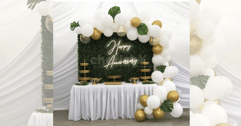 White And Golden Leaf Backdrop Decoration for an anniversary celebration on a terrace 