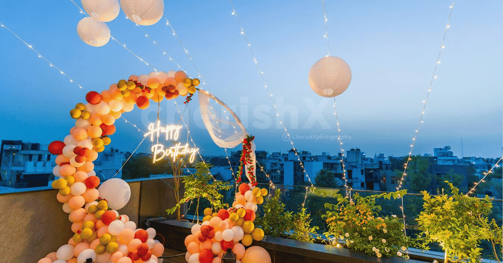 A ring backdrop adorned with a bunch of balloons and neon light 