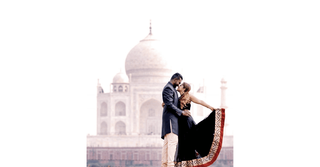 A romantic couple pose at Taj Mahal for the pre wedding shoot photos